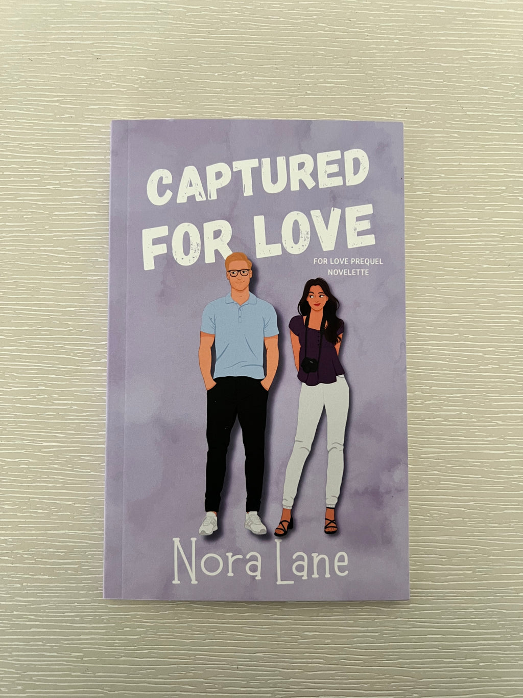 Captured for love signed paperback novelette by Nora Lane with character art & swag