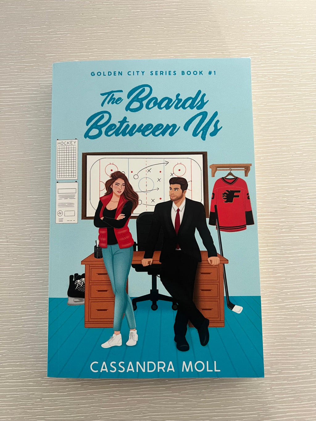 The Boards Between Us by Cassandra Moll signed paperback edition with bookmark