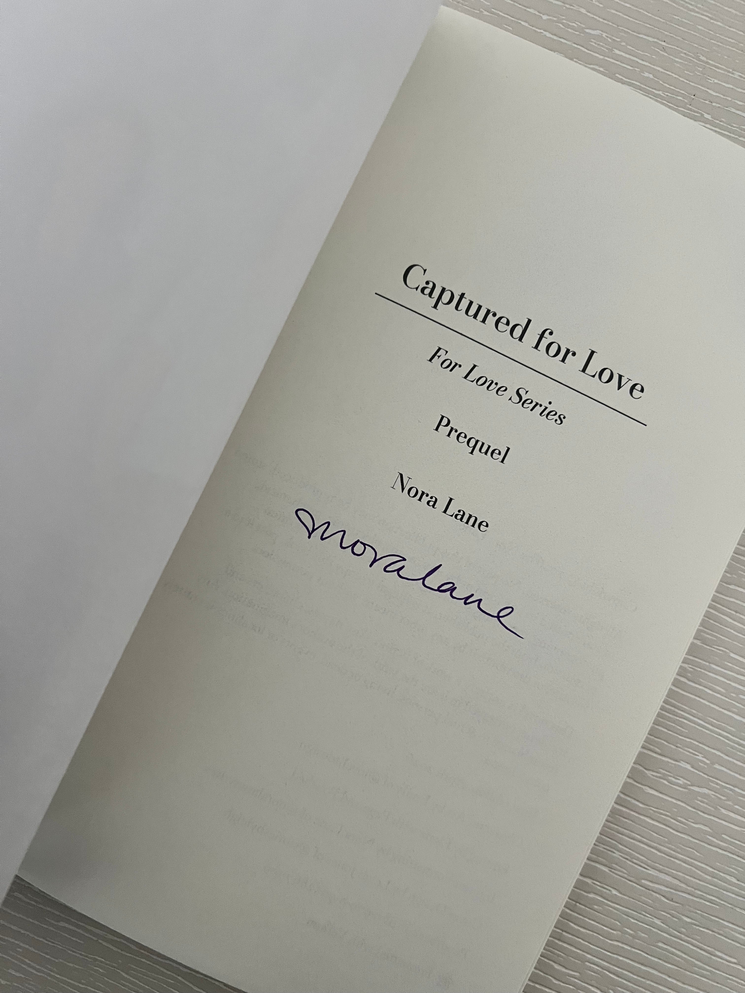 Captured for love signed paperback novelette by Nora Lane with character art & swag