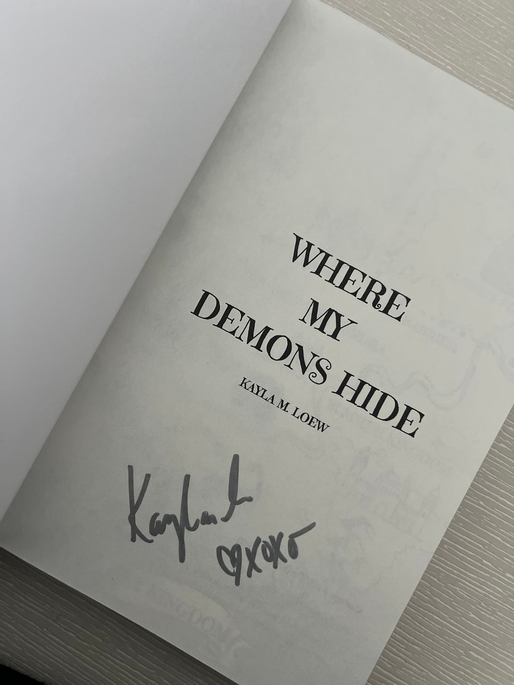 Where my demons hide signed paperback by Kayla Loew sprayed edges