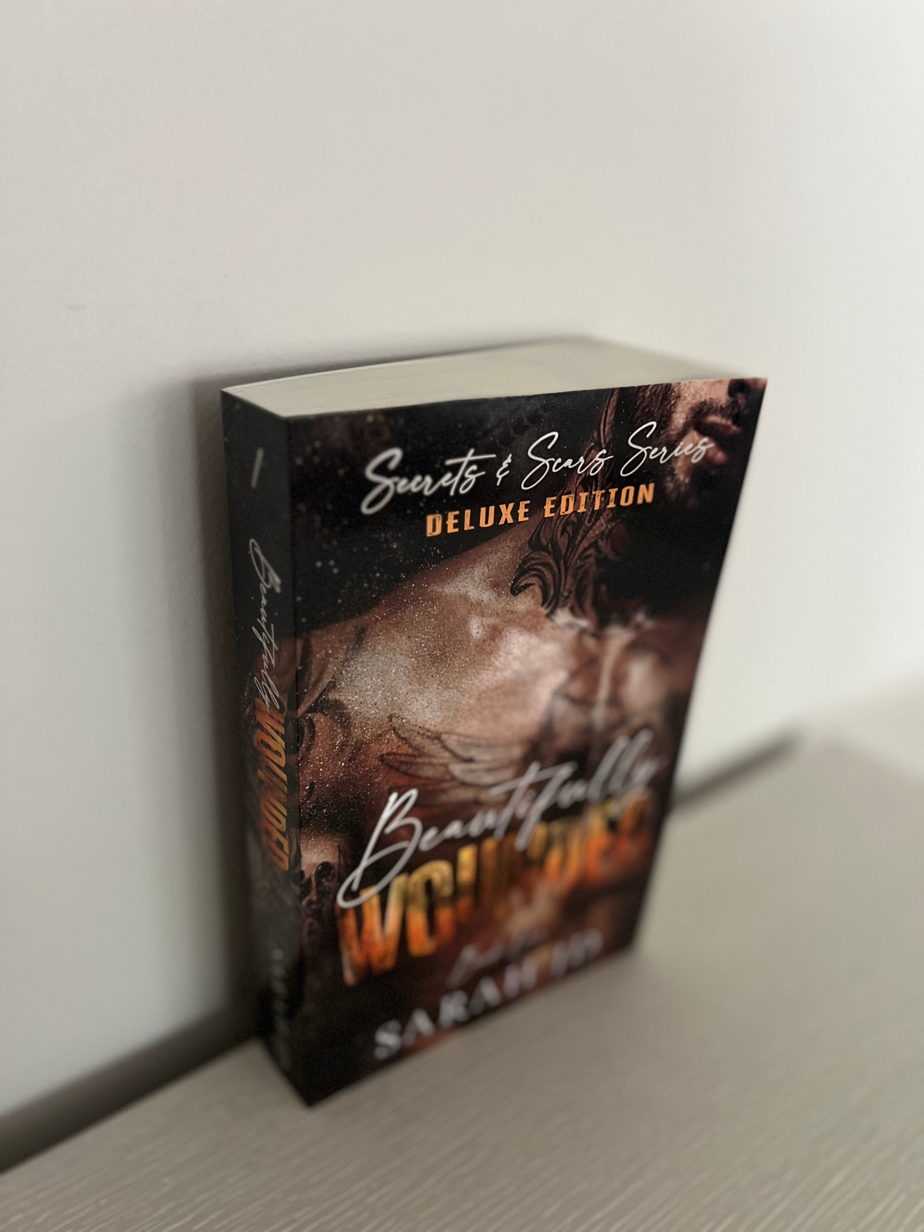 Beautifully Wounded by Sarah J.D, Deluxe edition paperback.
