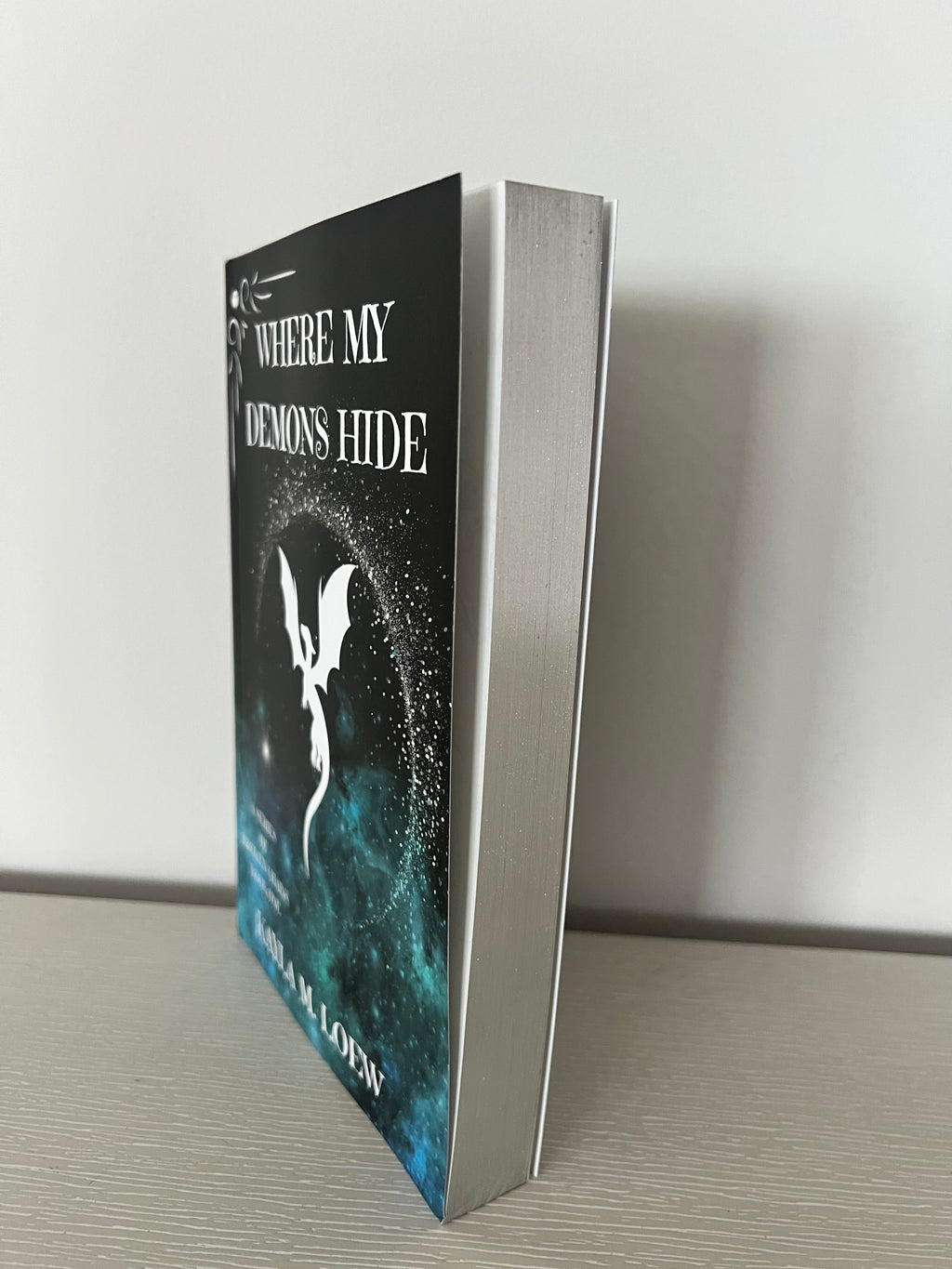 Where my demons hide signed paperback by Kayla Loew sprayed edges